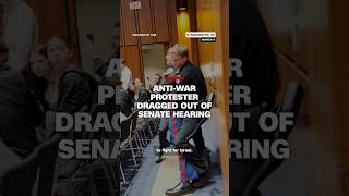 Anti-war protester dragged out of Senate hearing